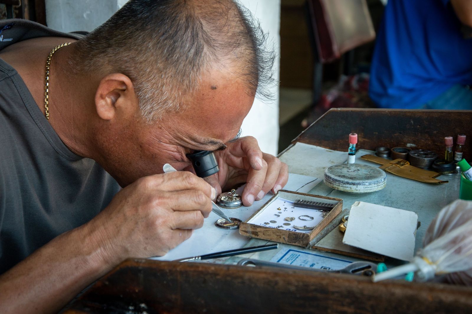 The long bench at the Loupe atelier, a setter at work under the lamp