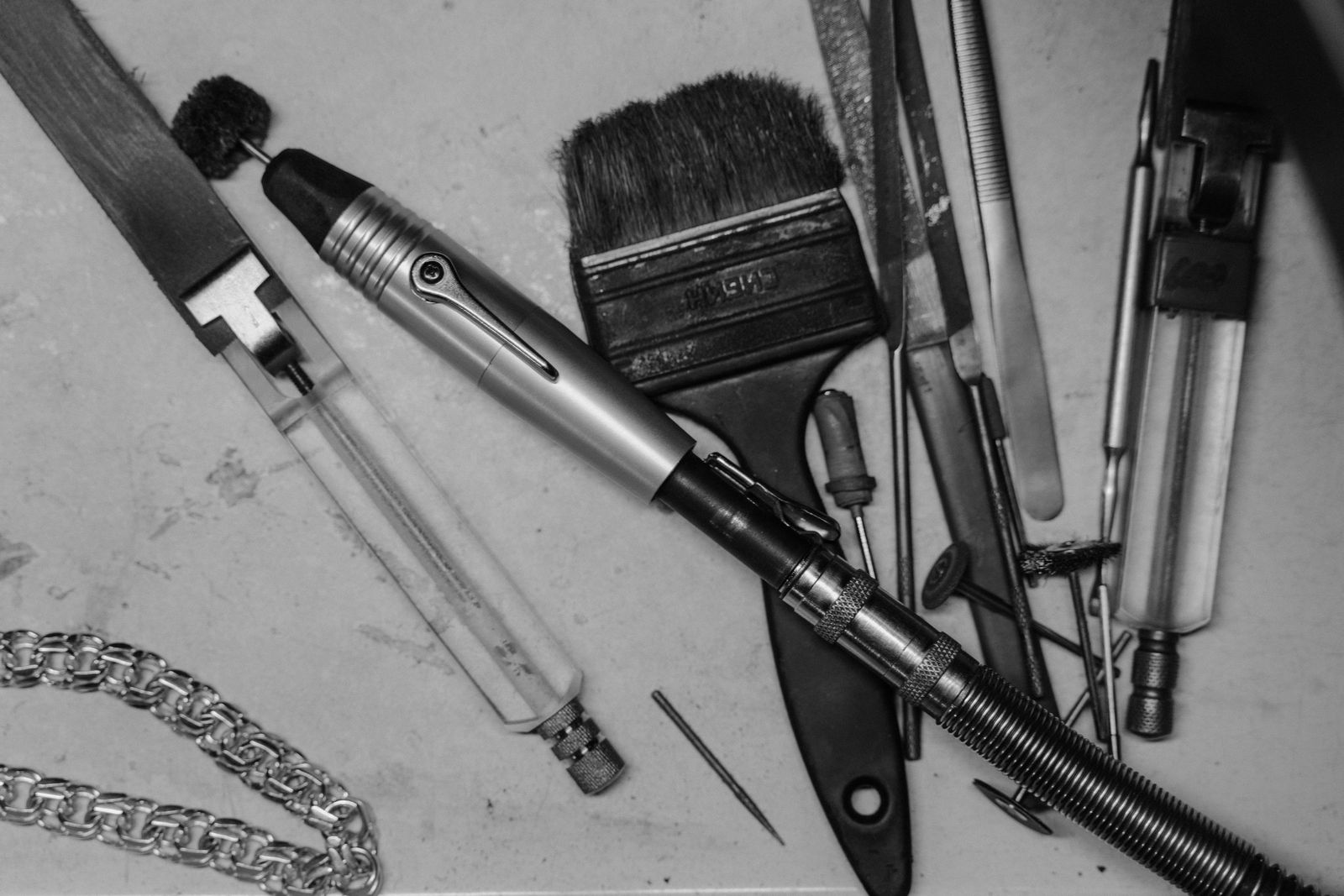 Pushers, burrs and a bezel roller laid out in a row