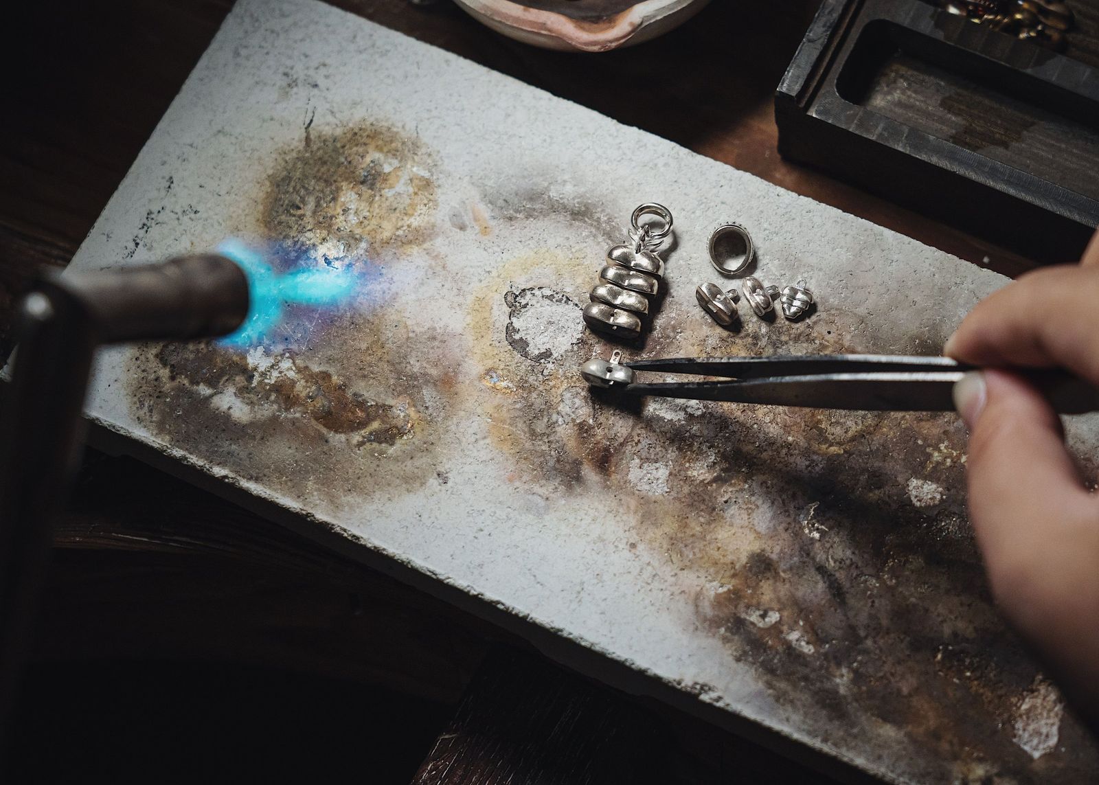 Old gold being melted with a torch
