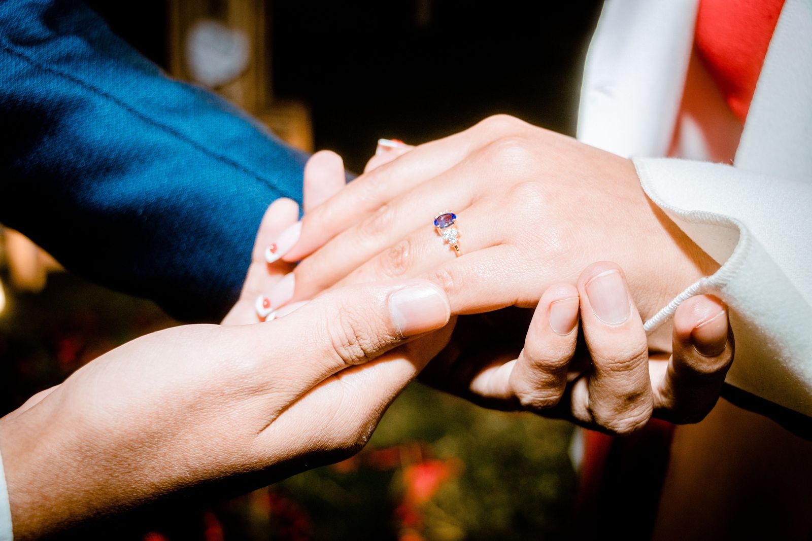 Two hands wearing new rings