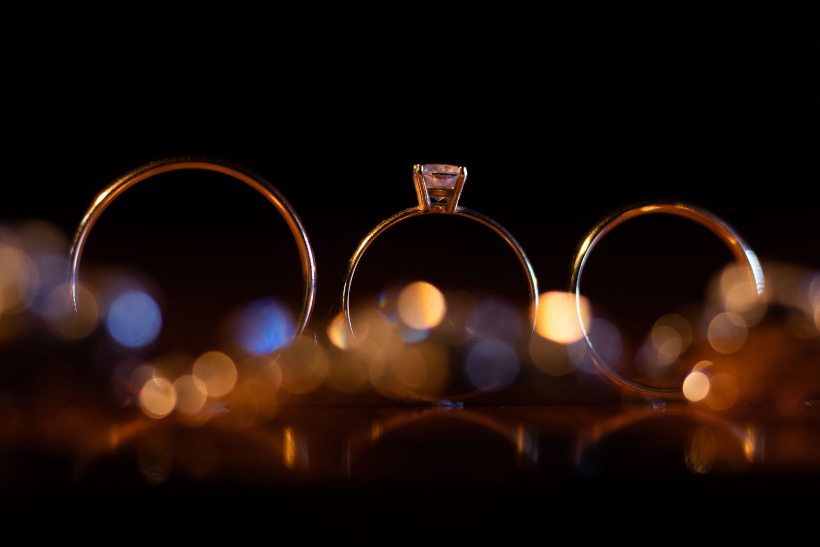 Three rings with warm lights behind